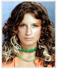 Brown curly hair with white highlights